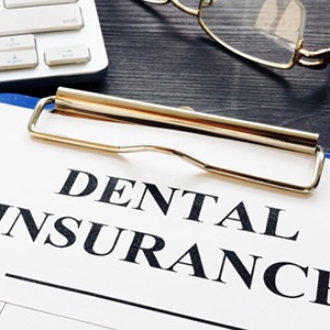 dental insurance paperwork on a clipboard 